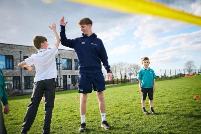 Male Coach High 5 Landscape